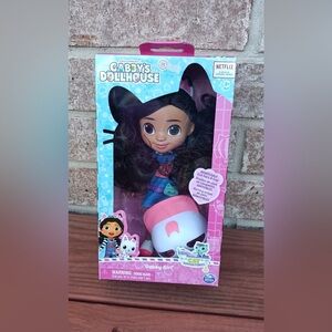 Gabby’s Dollhouse Gabby Girl Doll with Black Hair and Pink Outfit